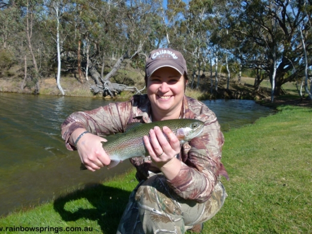 A lady catching a nice trout