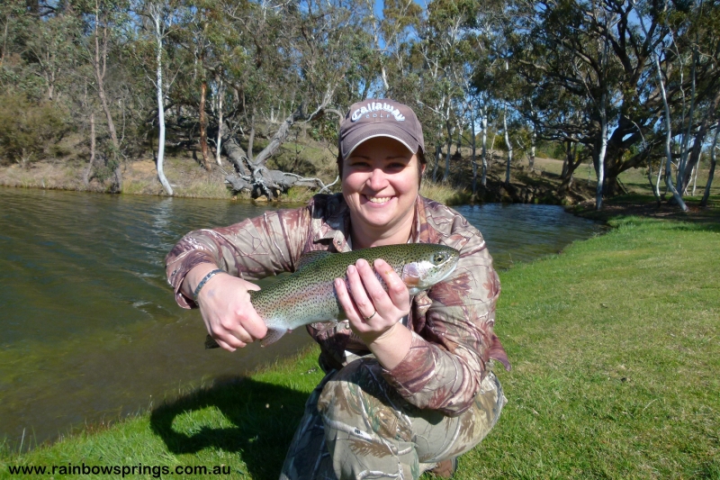 A lady catching a nice trout