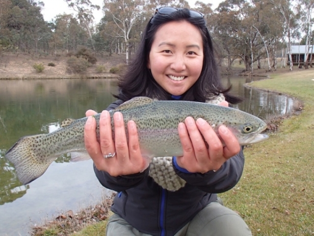 A lady with her pretty rainbow trout