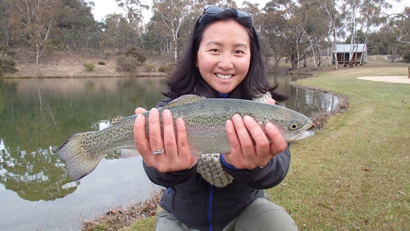 A lady with her pretty rainbow trout