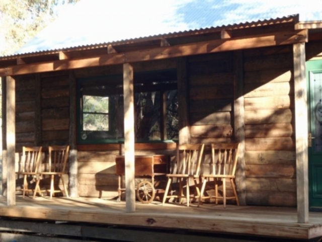 A verandah of timber slab hut