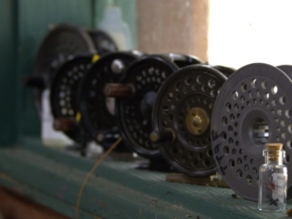 Old fly reels on a window ledge gathering dust