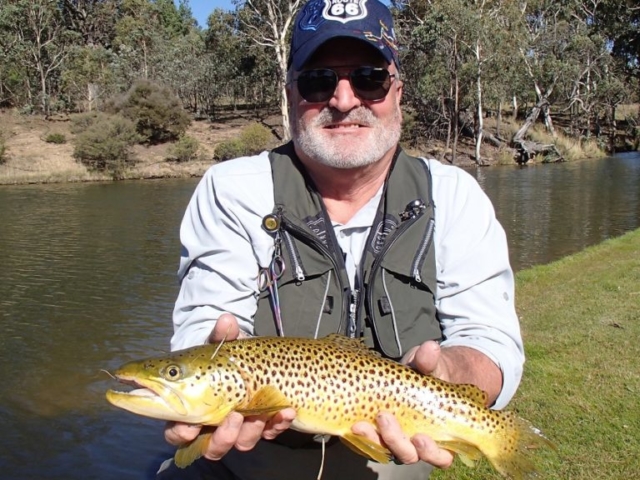 A man fly fishing with tiny flies