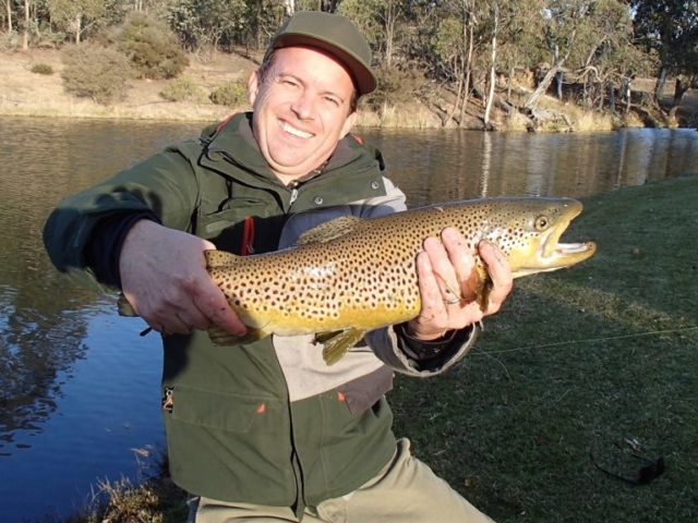 Smiles all round with this big brown trout