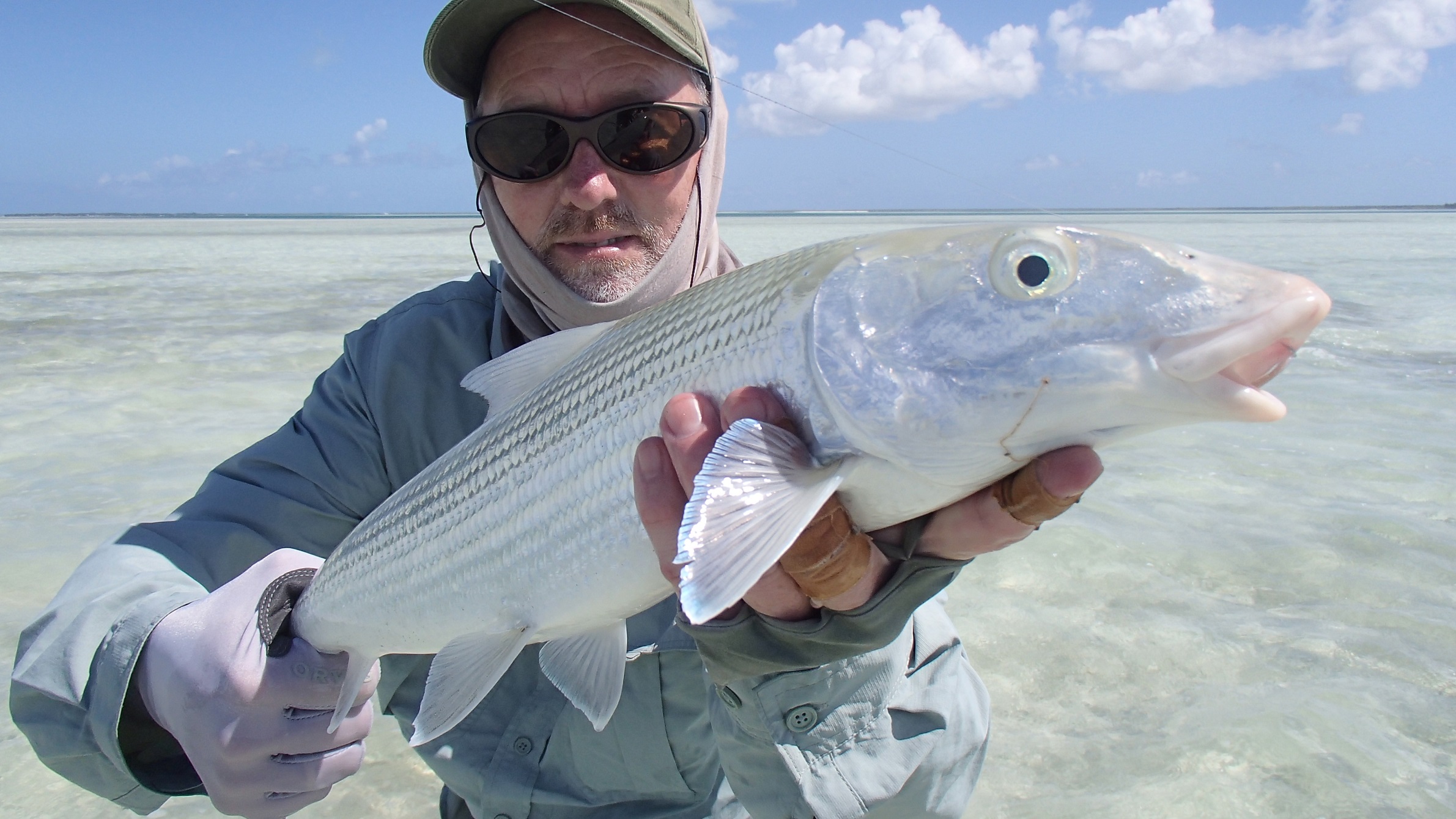 A man catching a Bonefish on the flats