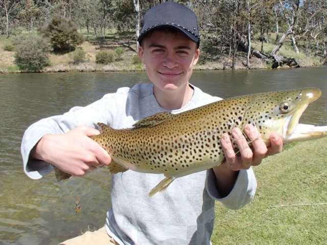 A young man with a fabulous trout