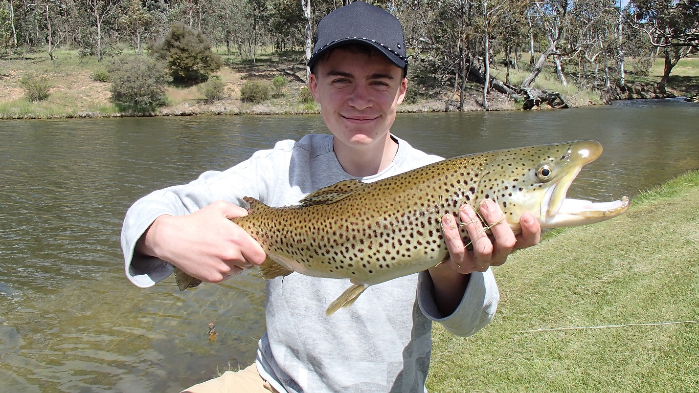 A young man with a fabulous trout