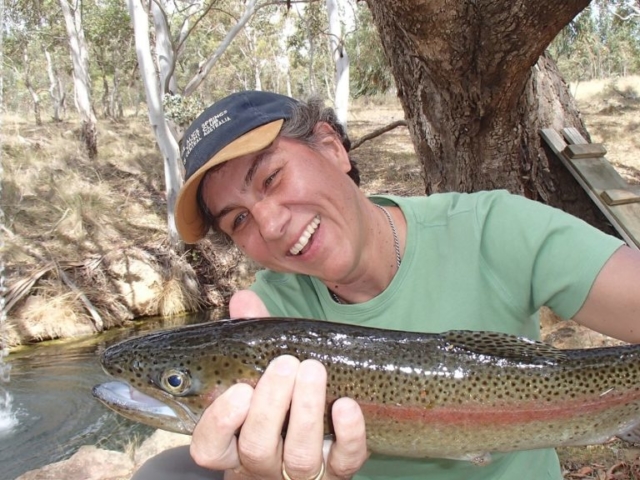 A very happy lady with her rainbow trout